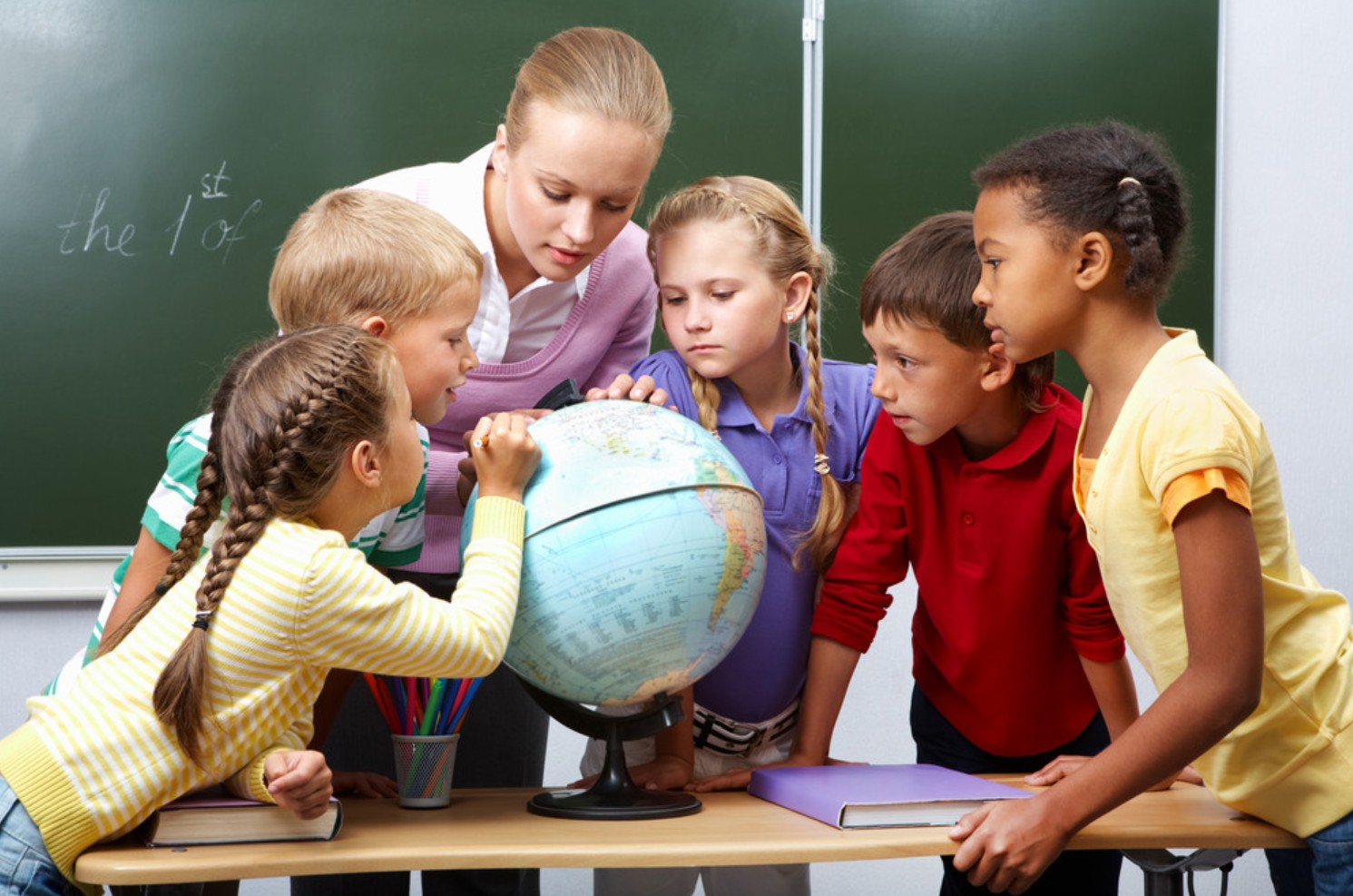 FundEDU | Tax Credit Scholarship Experts | The $1,700 Credit Is Not a Cut to Your School Budget A teacher and a diverse group of public-school students gather around a globe in a classroom